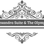 Ornate black decorative flourish with swirls and leaf motifs above and below a faded or blurred text banner; the text in the centre is difficult to read.